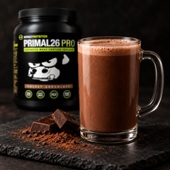 Finished chocolate shake Ready-to-drink Primal26 PRO Velvet Chocolate protein shake served in a glass with dark chocolate garnish